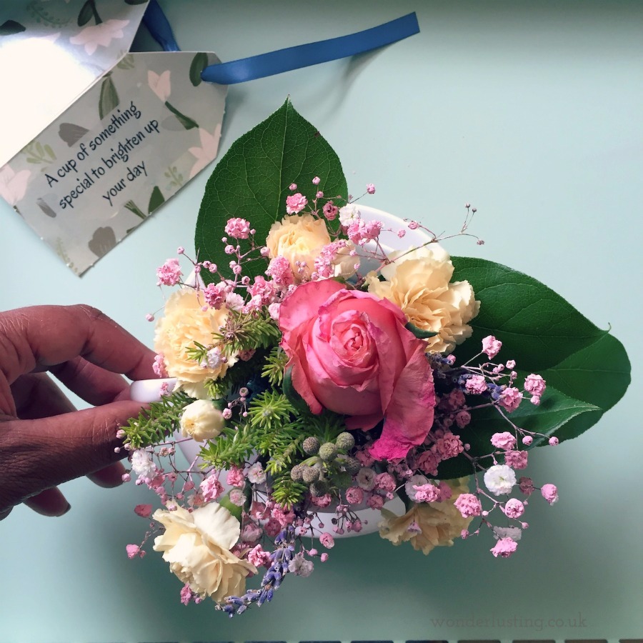 peach punch flowers in teacup