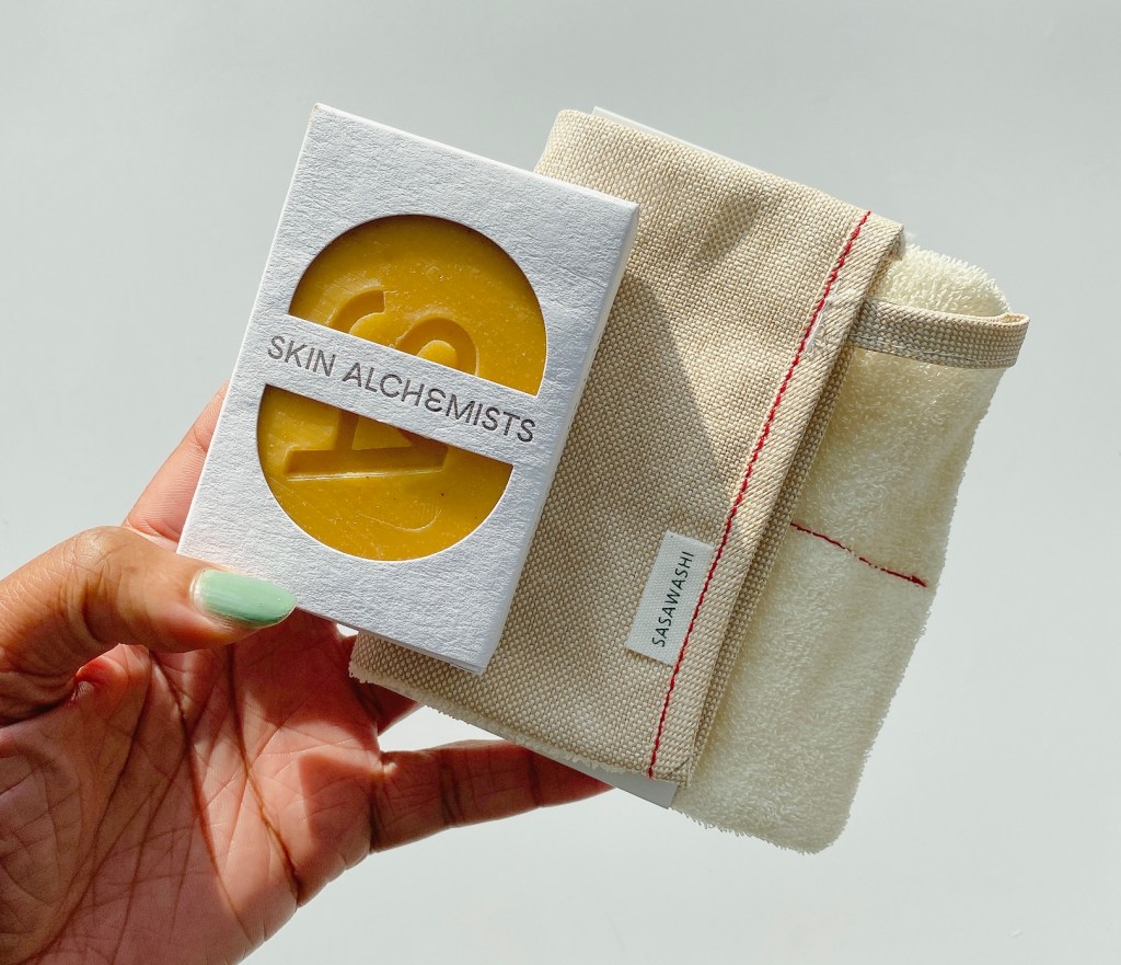 hand holding Skin alchemists artisan soap set